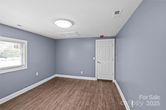 empty room featuring hardwood / wood-style flooring