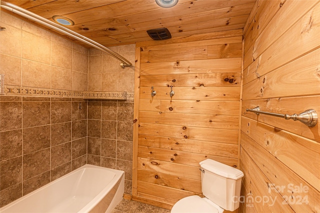 bathroom featuring wood walls, toilet, and wooden ceiling