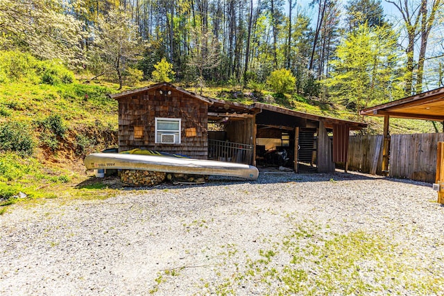 view of front of property with an outdoor structure