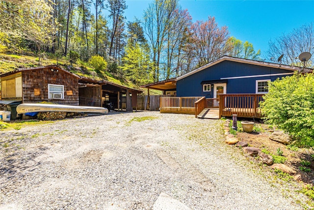 view of front of house with a wooden deck