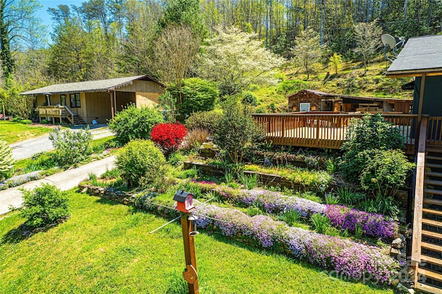 view of yard with a wooden deck