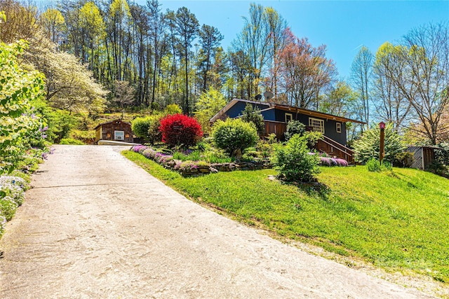 view of home's exterior with a lawn