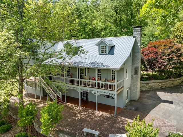 cape cod house with a porch