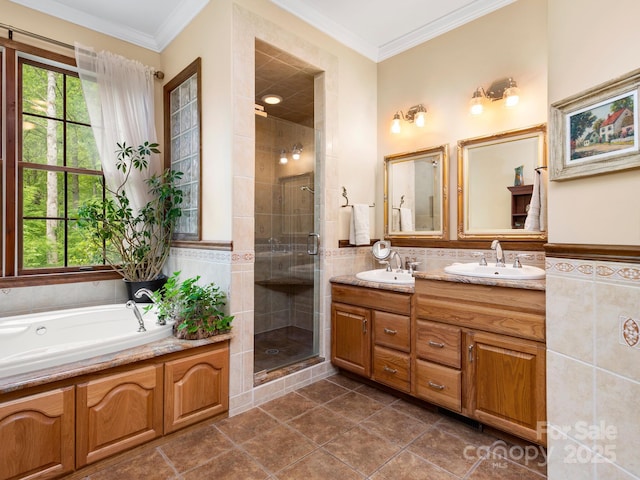 bathroom featuring tile walls, separate shower and tub, crown molding, and vanity