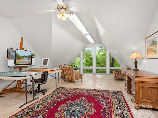 tiled home office featuring lofted ceiling and ceiling fan