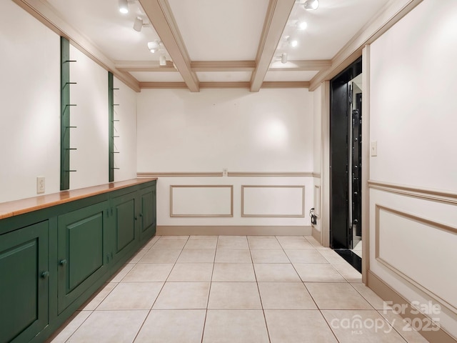 bathroom with tile patterned flooring, beam ceiling, crown molding, and coffered ceiling