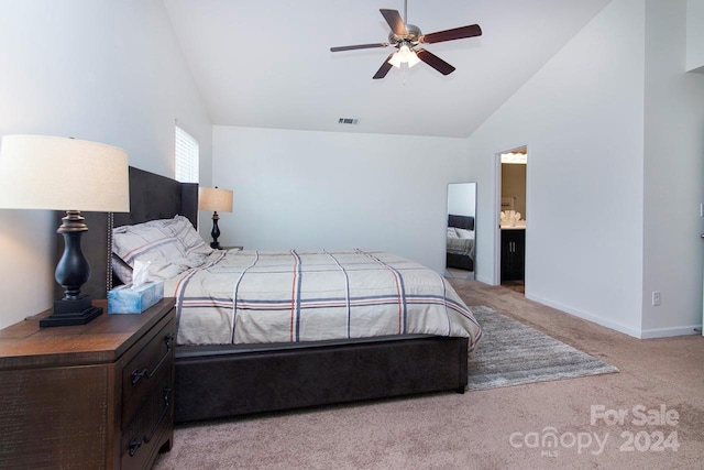 bedroom with lofted ceiling, light carpet, ceiling fan, and ensuite bathroom