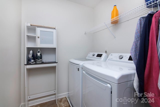 clothes washing area featuring washing machine and clothes dryer