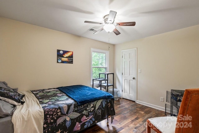 bedroom featuring ceiling fan and dark hardwood / wood-style floors