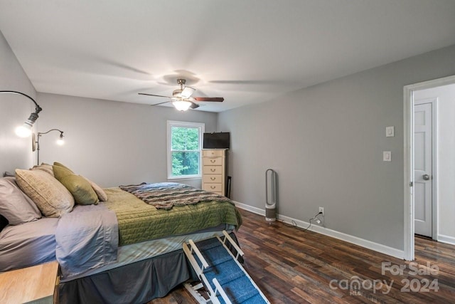 bedroom with ceiling fan and dark hardwood / wood-style floors