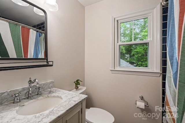 bathroom with vanity and toilet