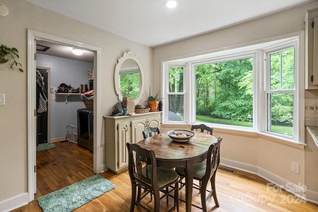 dining room with light hardwood / wood-style floors