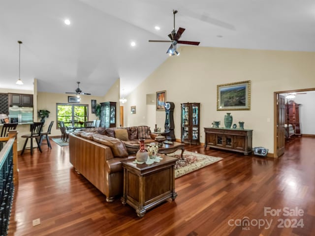 living room featuring high vaulted ceiling, dark hardwood / wood-style flooring, and ceiling fan