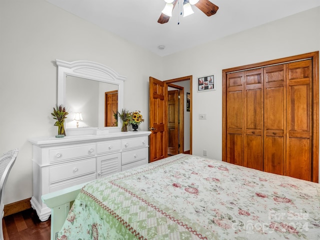 bedroom with dark hardwood / wood-style flooring, ceiling fan, and a closet