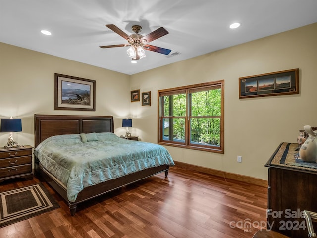 bedroom with wood-type flooring and ceiling fan