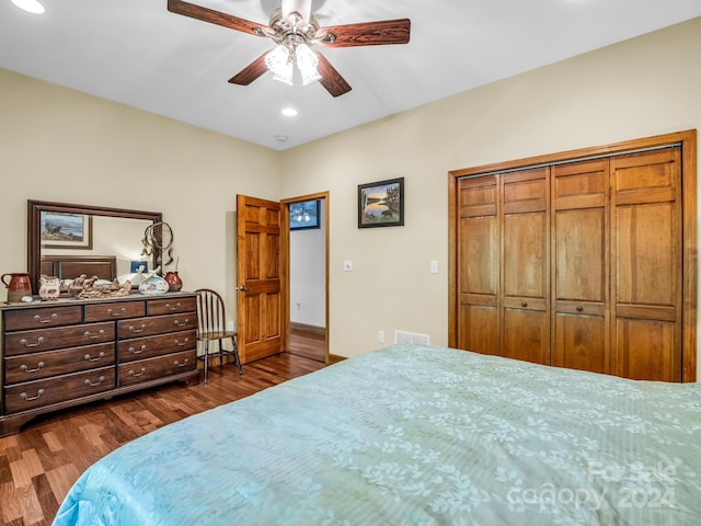 bedroom featuring a closet, ceiling fan, and dark hardwood / wood-style flooring