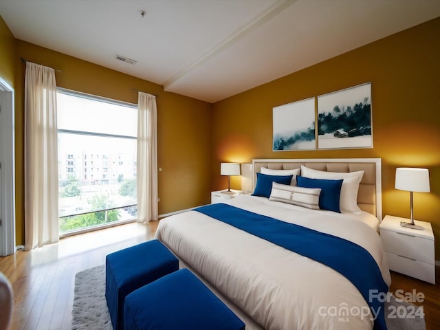 bedroom with light hardwood / wood-style floors