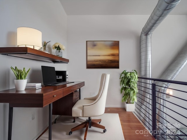 office space with hardwood / wood-style flooring