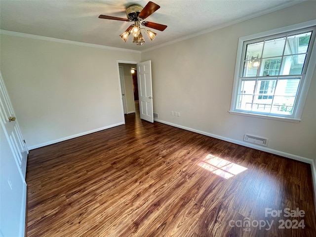 unfurnished room with a textured ceiling, ceiling fan, ornamental molding, and wood-type flooring