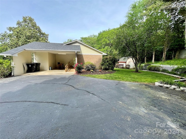 view of side of property with a yard