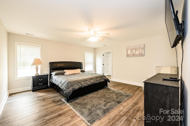 bedroom featuring ceiling fan and hardwood / wood-style floors