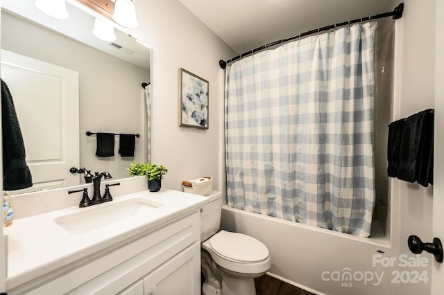 full bathroom featuring toilet, vanity, and shower / bathtub combination with curtain