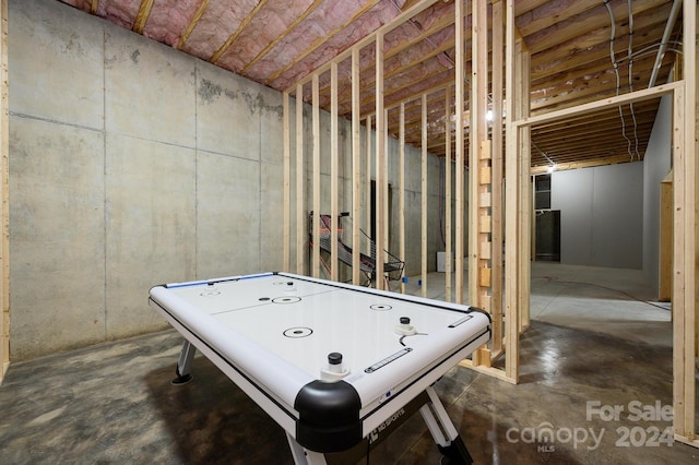 rec room featuring concrete flooring