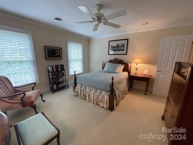 carpeted bedroom featuring multiple windows, crown molding, and ceiling fan