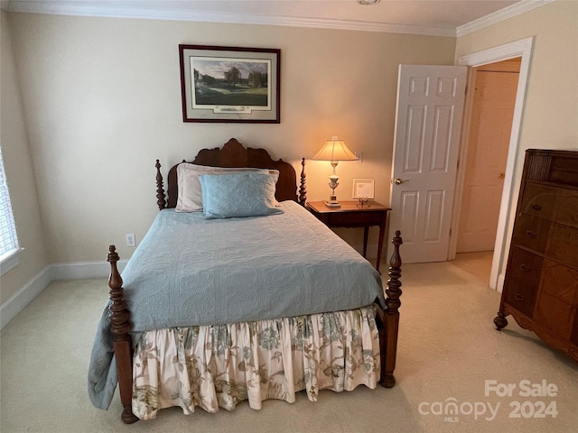 carpeted bedroom featuring crown molding