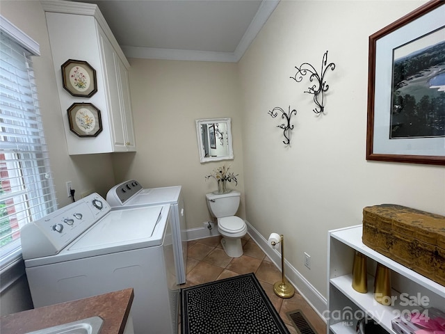 laundry room featuring tile flooring, sink, ornamental molding, and separate washer and dryer