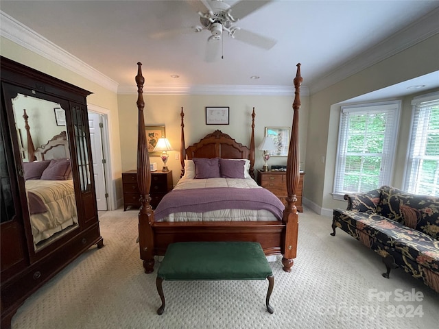 carpeted bedroom with ornamental molding and ceiling fan