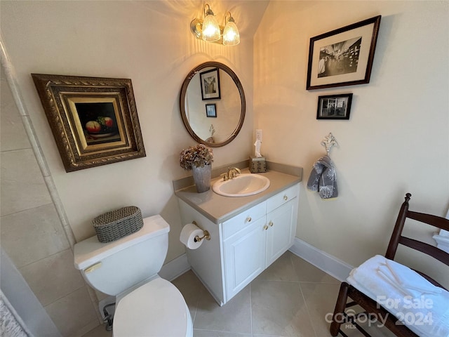 bathroom featuring vanity, toilet, and tile flooring