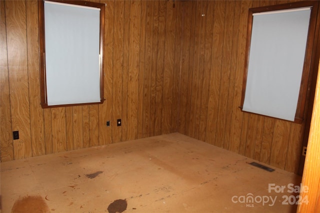 empty room with wooden walls