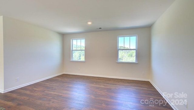 empty room featuring dark hardwood / wood-style floors