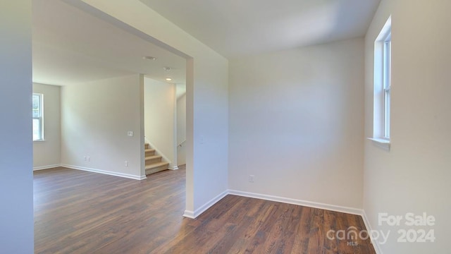 spare room featuring dark hardwood / wood-style floors