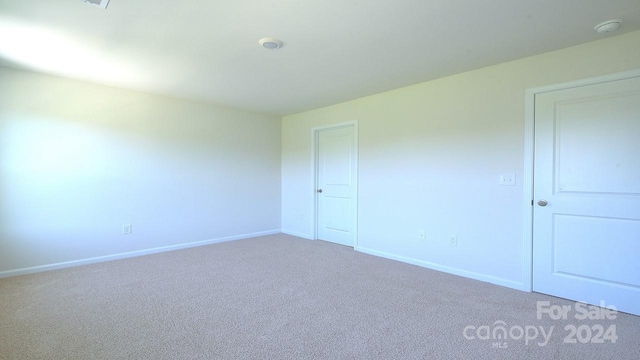 spare room featuring carpet flooring