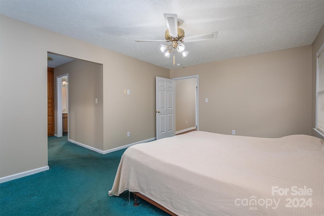 bedroom with a textured ceiling, ceiling fan, and carpet floors