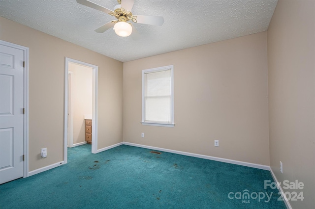 unfurnished bedroom with a textured ceiling, ceiling fan, and carpet floors