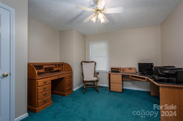 carpeted home office featuring ceiling fan and a textured ceiling