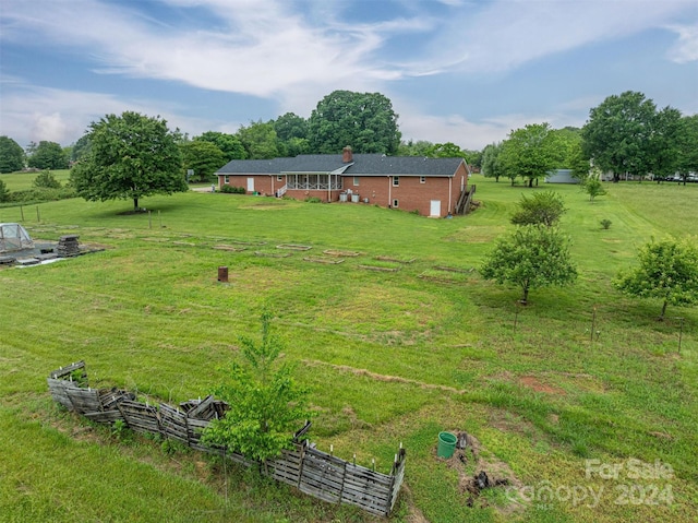 view of yard with a rural view