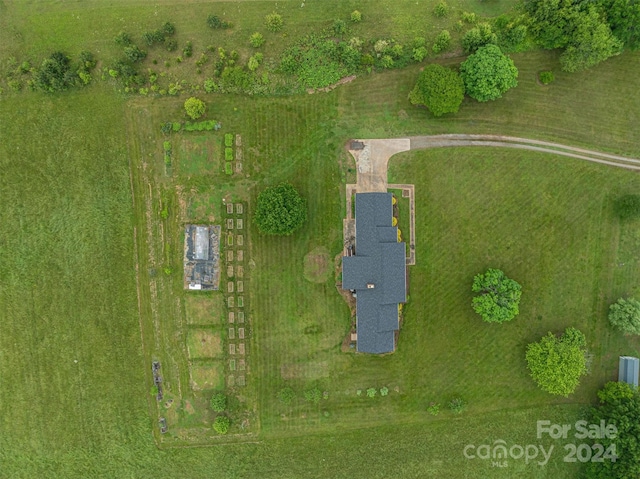 birds eye view of property featuring a rural view