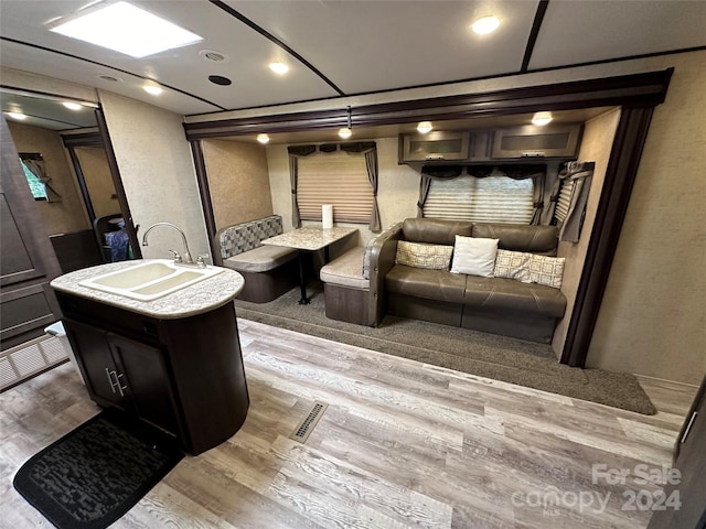 interior space featuring sink and wood-type flooring