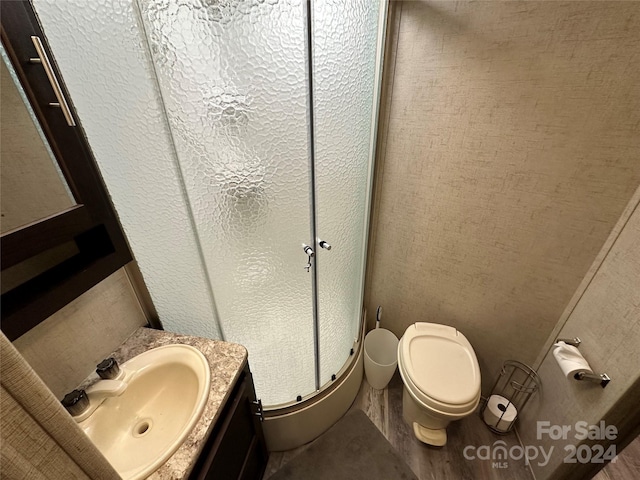 bathroom featuring oversized vanity and toilet