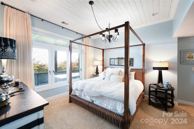 bedroom with french doors, carpet, an inviting chandelier, and crown molding