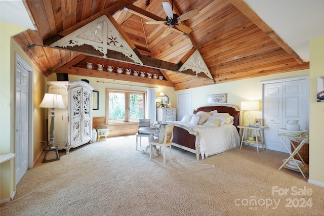 bedroom featuring wood ceiling, ceiling fan, and carpet