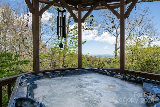 view of patio / terrace featuring a hot tub