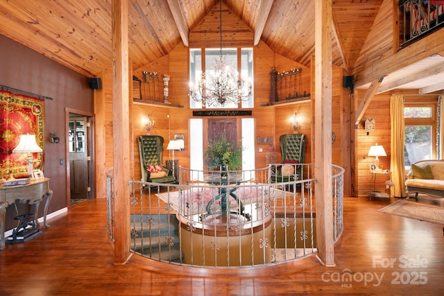 1052 Toxaway Dr, Lake Toxaway, NC 28747 - foyer entrance with wood-type flooring, high vaulted ceiling, wooden ceiling, a chandelier, and wooden walls