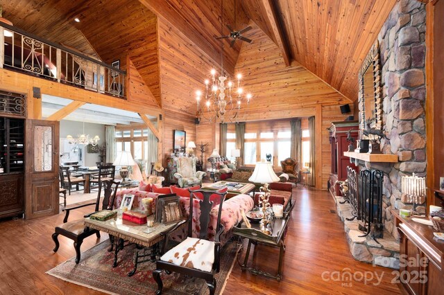 1052 Toxaway Dr, Lake Toxaway, NC 28747 - living area featuring a fireplace, a chandelier, high vaulted ceiling, wood ceiling, and wood finished floors