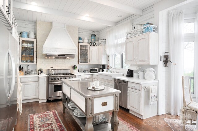 1052 Toxaway Dr, Lake Toxaway, NC 28747 - kitchen with appliances with stainless steel finishes, custom exhaust hood, a sink, light countertops, and tasteful backsplash