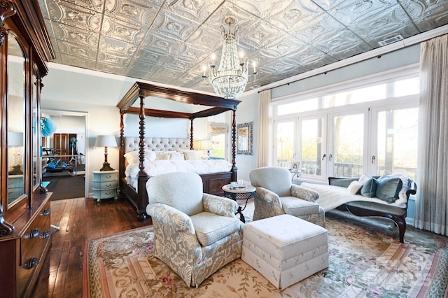 1052 Toxaway Dr, Lake Toxaway, NC 28747 - bedroom featuring a chandelier, access to exterior, hardwood / wood-style flooring, an ornate ceiling, and french doors